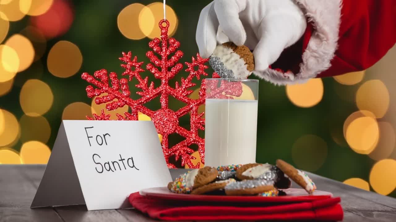 산타클로스가 오렌지색 빛 반점 위에서 쿠키를 뽑는 애니메이션