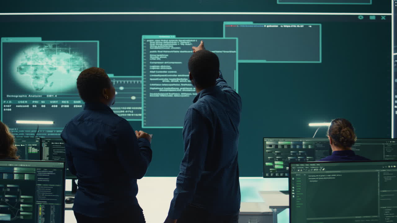 Cyber security team conducting cyber surveillance in governmental control room