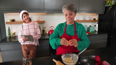 at christmas, senior women baking together in kitchen, sharing laughter and holiday joy