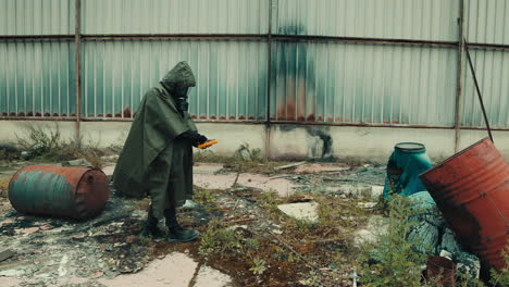 man with geiger counter in nuclear site