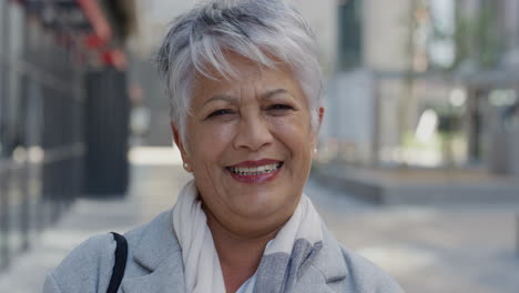 portrait-happy-senior-indian-business-woman-executive-laughing-enjoying-carefree-urban-lifestyle-in-city-happy-mature-entrepreneur-slow-motion