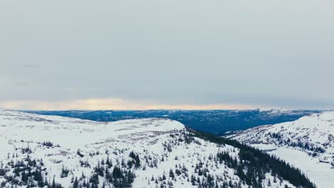 flying over snowscape mountain hikes near verran, indre fosen, norway