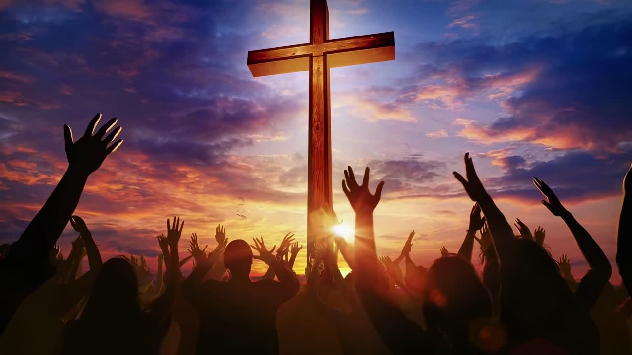 People Worshiping with Raised Hands Before a Cross at Sunset