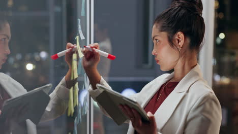 businesswoman brainstorming with sticky notes in office