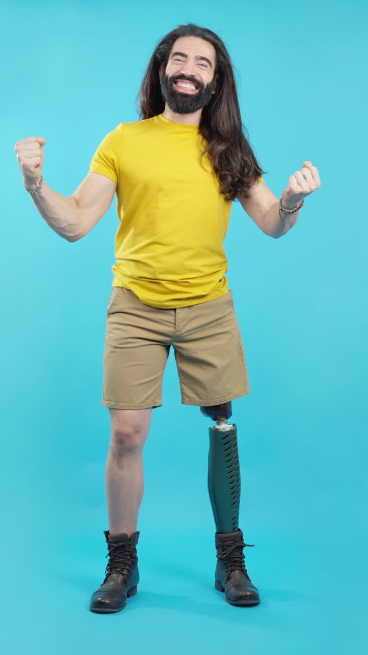 Happy man with prosthetic leg celebrating success and triumph