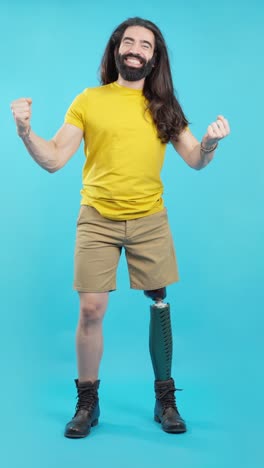 happy man with prosthetic leg celebrating success and triumph