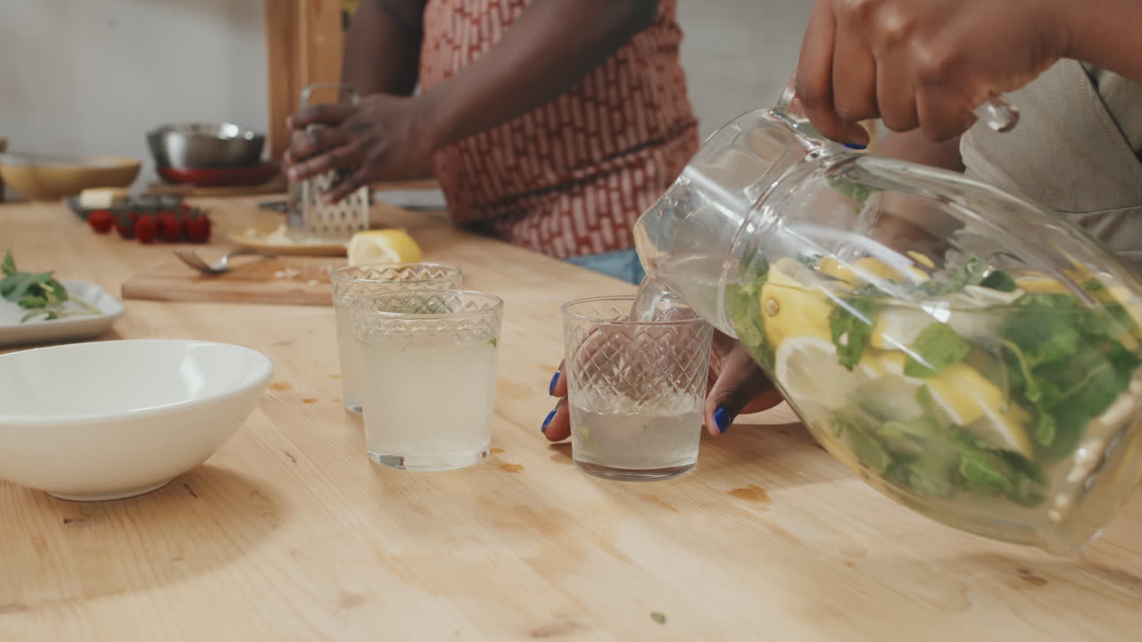 Pouring Homemade Lemonade in Glasses
