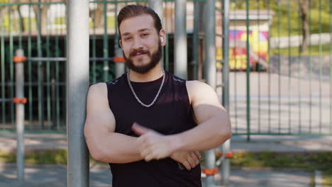 athletic lebanese man in sportswear raises thumbs up gives positive feedback likes good motivation