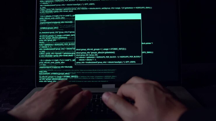 Hands Hacker Using Laptop Computer Hacking In The Dark Room