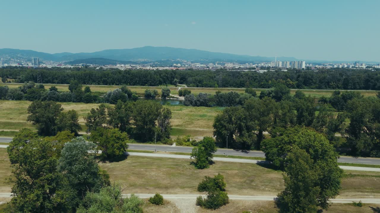 aerial of Zagreb skyline seen behind abandoned hospital in Blato near the Sava River embankment