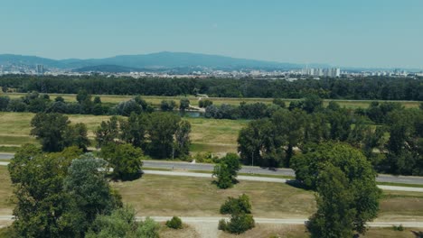 aerial of zagreb skyline seen behind abandoned hospital in blato near the sava river embankment