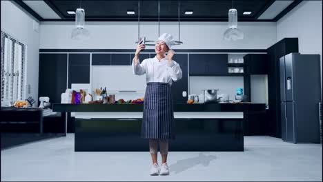 chef taking a selfie in a modern kitchen