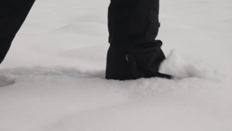 shot of person walking through soft powder snow