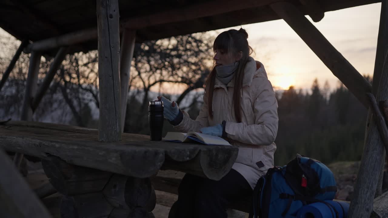 Woman reading in a cabin