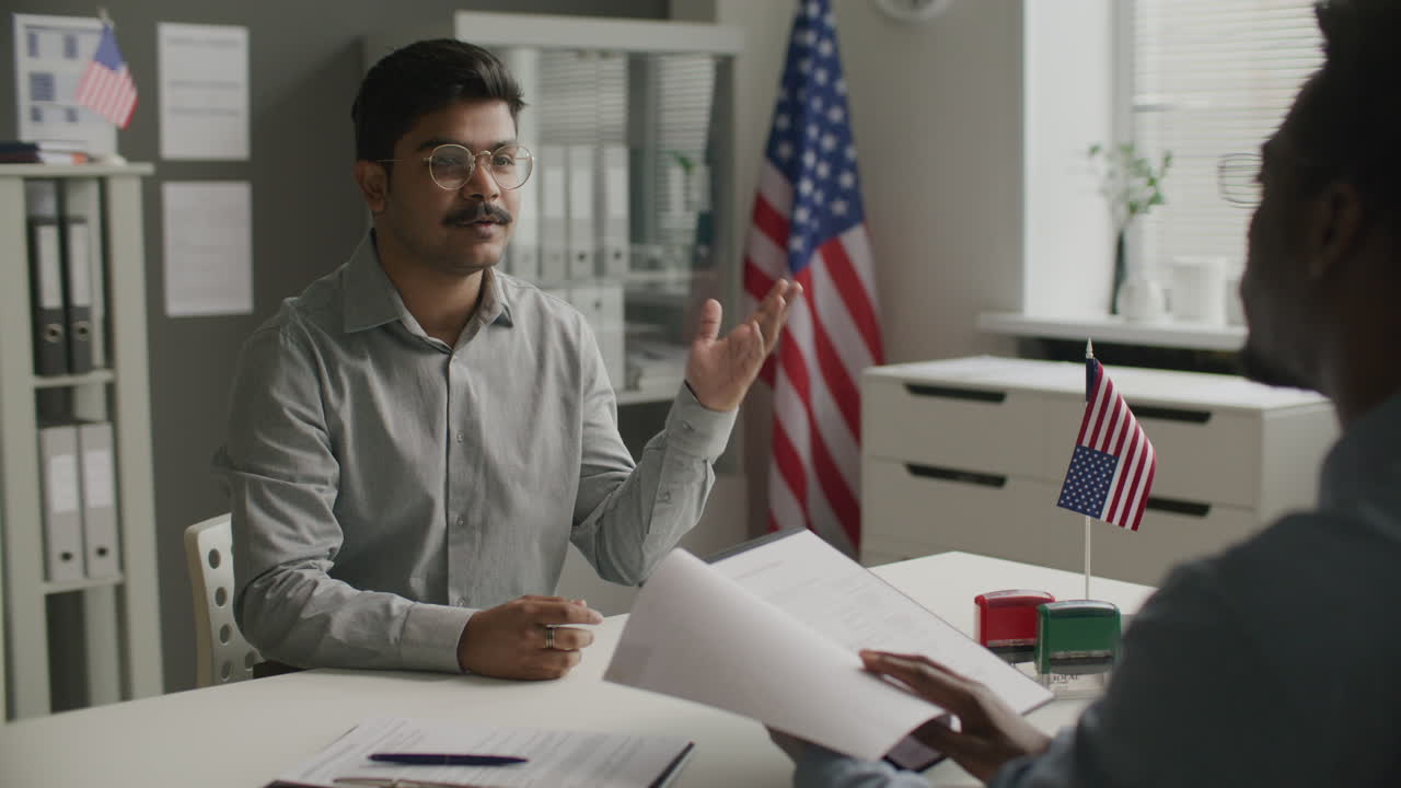 Indian Man Answering Questions during US Visa Interview at Embassy