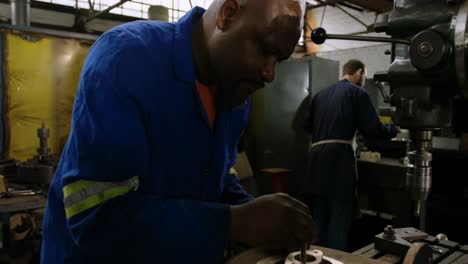 metalsmith working in workshop 4k