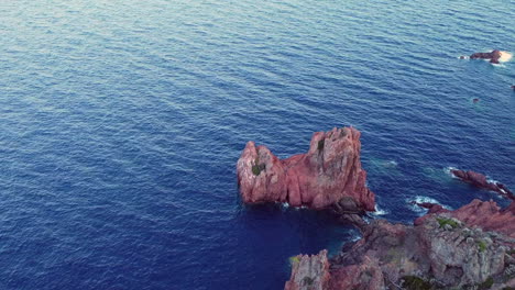 a beautiful aerial landscape of the coast of france and the golden island at sunset