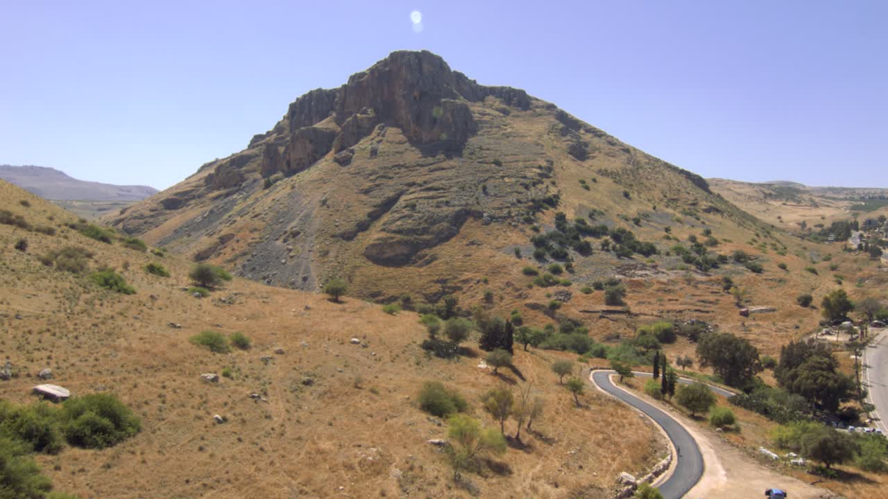 The beautiful Arbell mountain of the holy land of Israel by a roadway - aerial