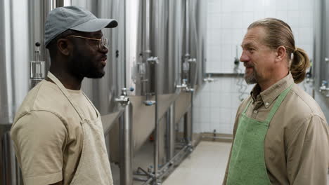 two men interacting indoors