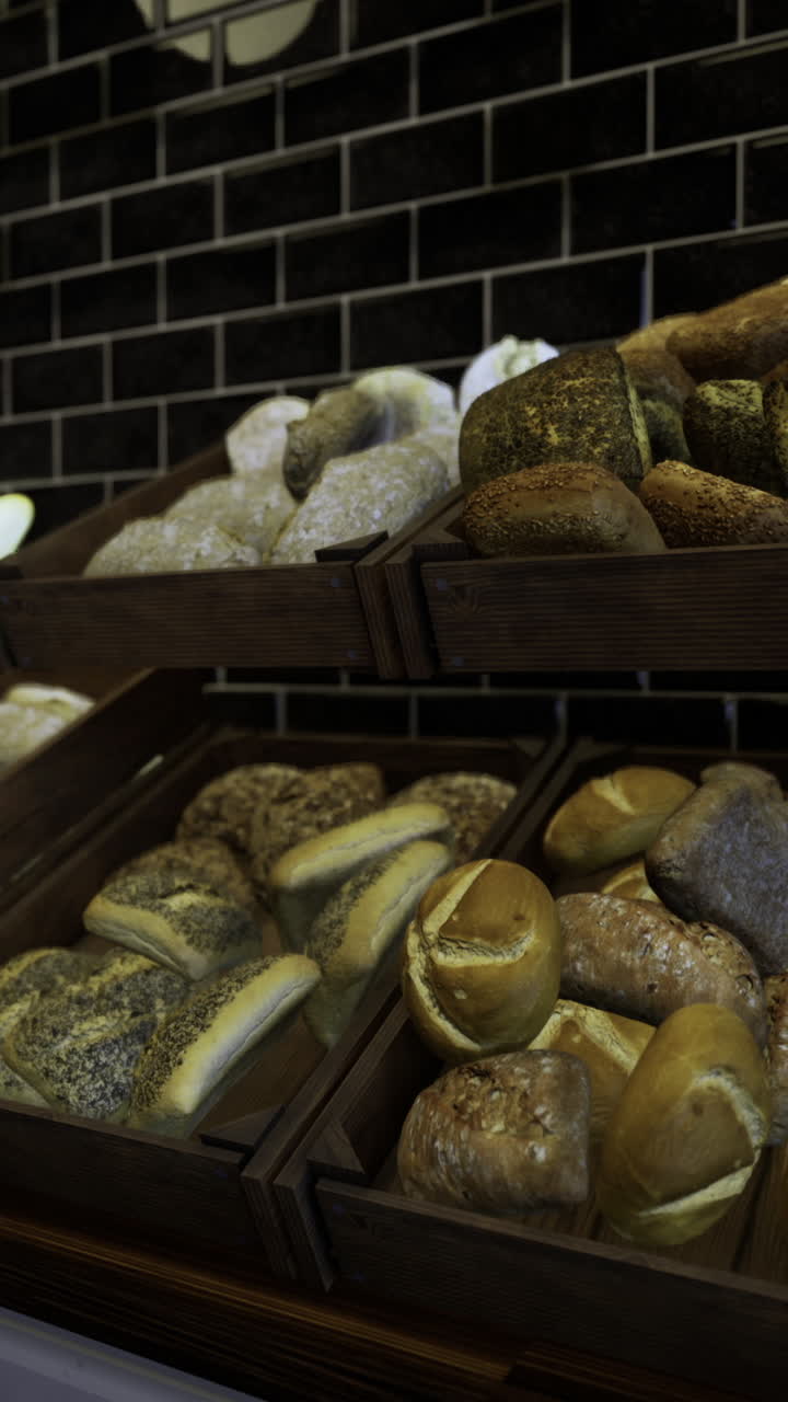 Artisan breads displayed in rustic wooden crates at a bakery