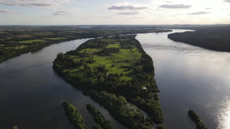 Overview-Of-Green-Ait-Surrounded-With-Water-In-Middle-Of-Island,-Uruguay