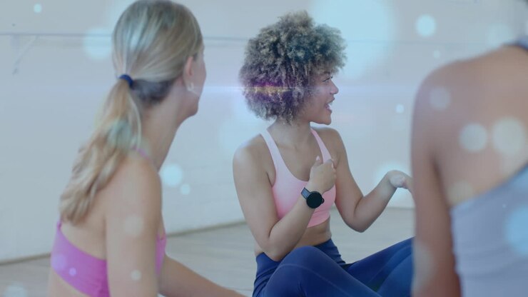 Sitting on floor and talking, women with fitness wear over bokeh lights animation