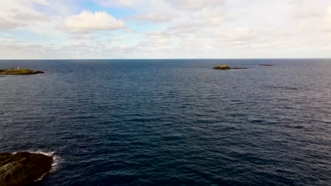 Small-rocky-islands-placed-in-the-icy-cold-artic-ocean-of-Northern-Norway