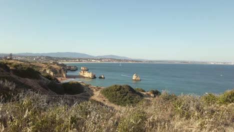 Viewing-Portuguese-coastal-city-Lagos-from-distance,-wide