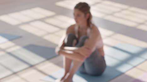 unhappy caucasian woman in yoga class looking sad sitting on exercise mat disappointed female body shame