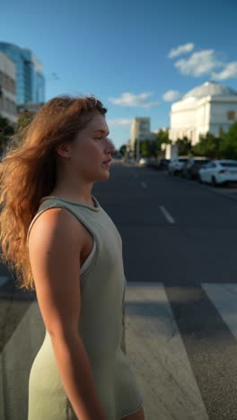 woman walking across a city crosswalk