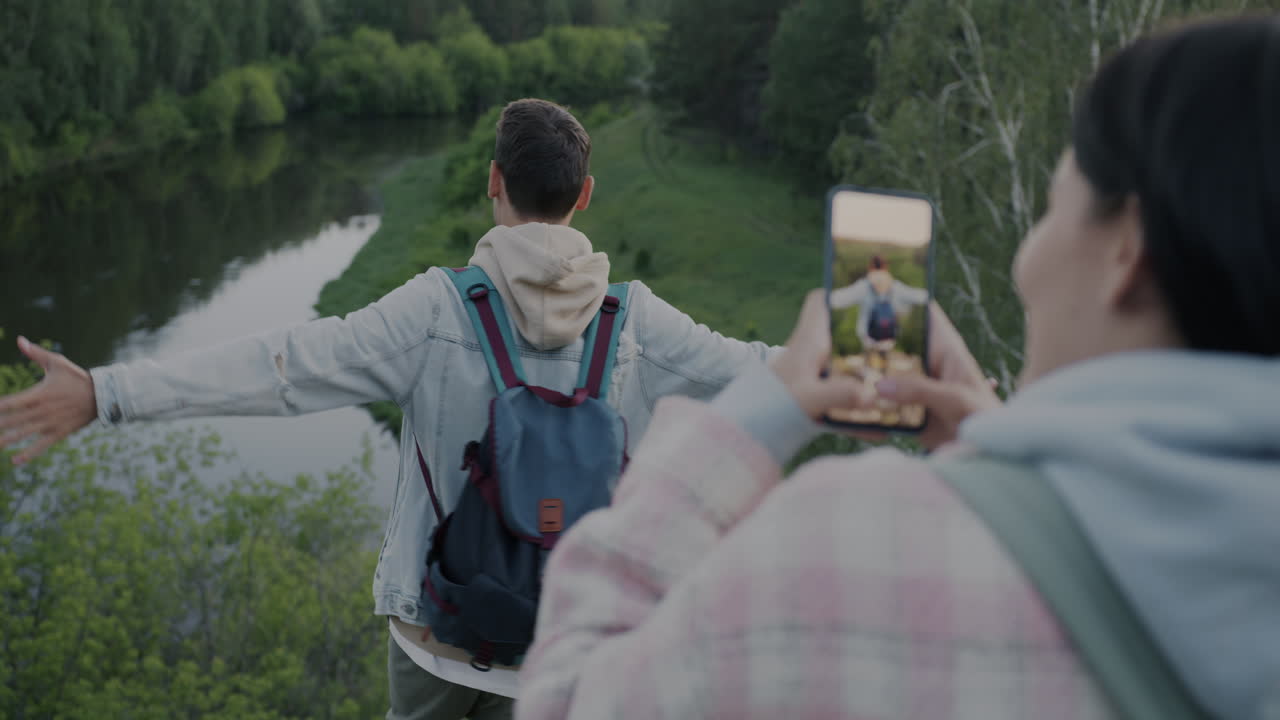Couple Taking Pictures in Nature