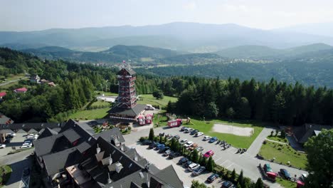 stunning drone shot of fire figters training tower in the mountains landscape on sunny day 4k