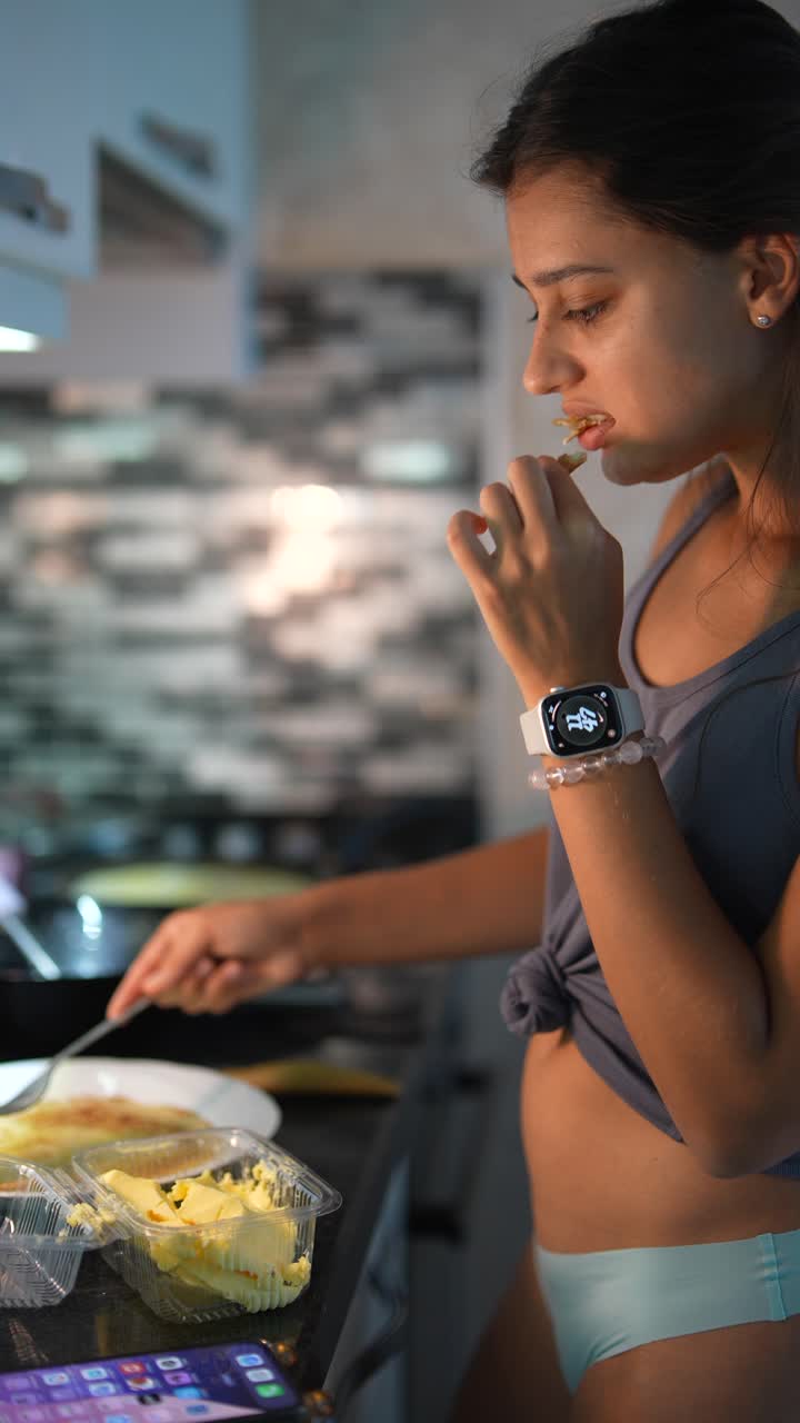Woman Cooking and Eating Pancakes