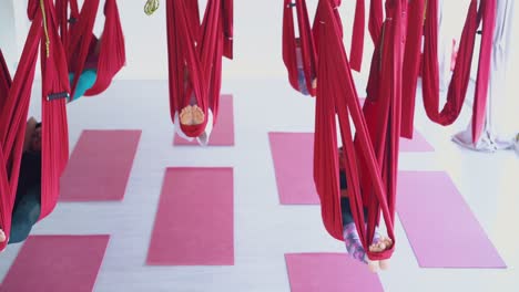 ladies group with bare feet sleeps swinging in hammocks