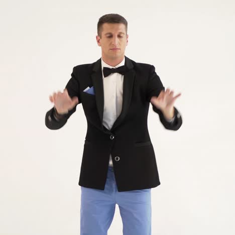 a man in a black jacket is depicting play the piano on a white background in the studio. Parody of the pianist or the instrument