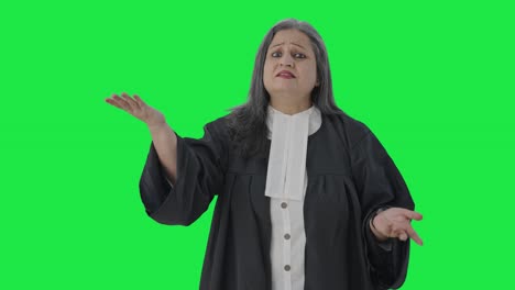 Happy-Indian-senior-female-lawyer-fighting-the-case-in-court-Green-screen