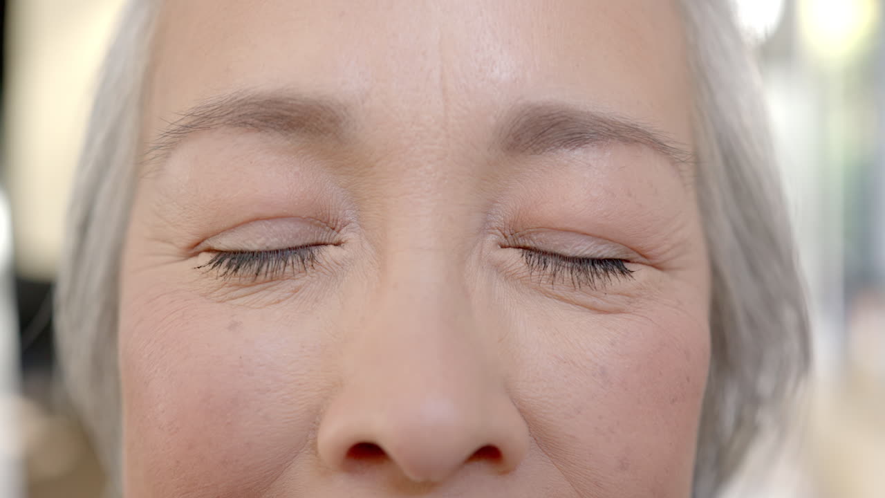 Close-up of elderly woman's eyes, showing wrinkles and aging gracefully