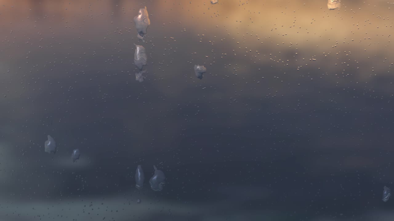 오후에 강이 보이는 창문에 빗방울이 배경을 흐릿하게 만든다