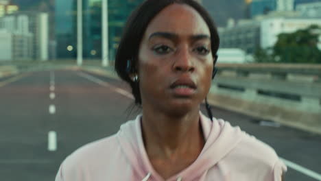 Face,-earphones-or-black-woman-in-city-running