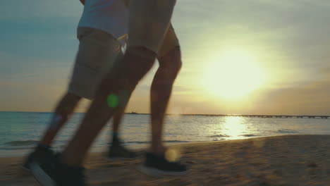 father and son are running by the sea