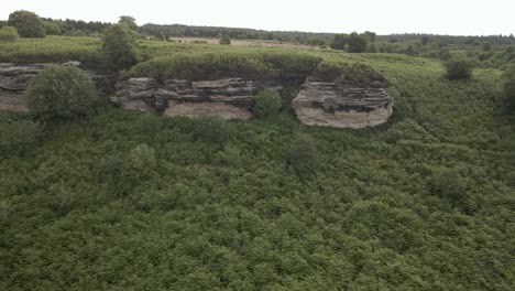 4k-Aerial-footage-of-Bridstones-sandstone-rock-formations-in-Dalby-Forest,-North-Yorkshire