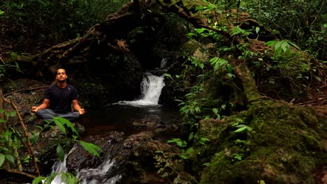 man meditating at waterfall cover with green lush forest flat angle clip