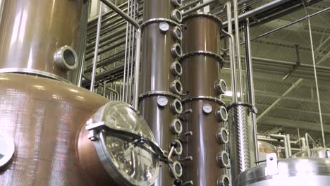 whisky distiller in large brewery and distillery