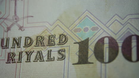 this is the macro view of a normal paper bank not- money- currency ofsaudi arabia 100 riyals bill