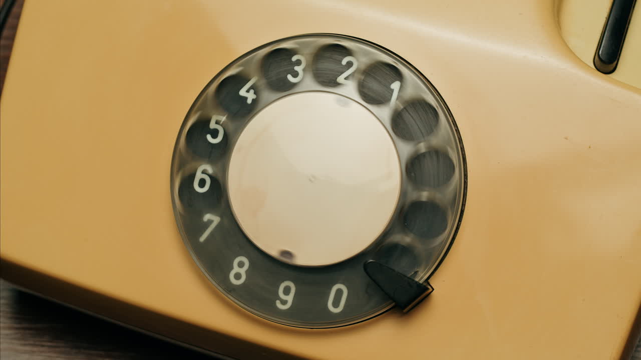 Retro vintage phone, A yellow rotary telephone is displayed on a wooden desk, adding a nostalgic touch