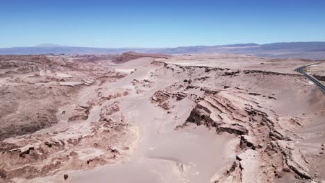 aerial flight above dunes in moon valley, landscape of atacama desert