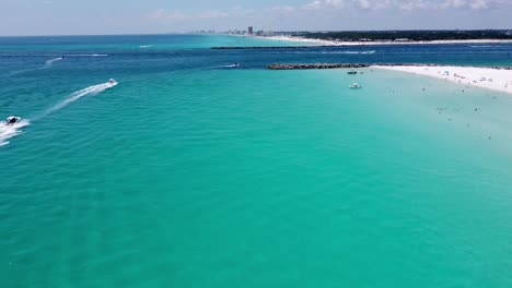 flying over the crystal clear blue, green, turquoise water of shell island, panama city beach in florida emerald coast panhandle