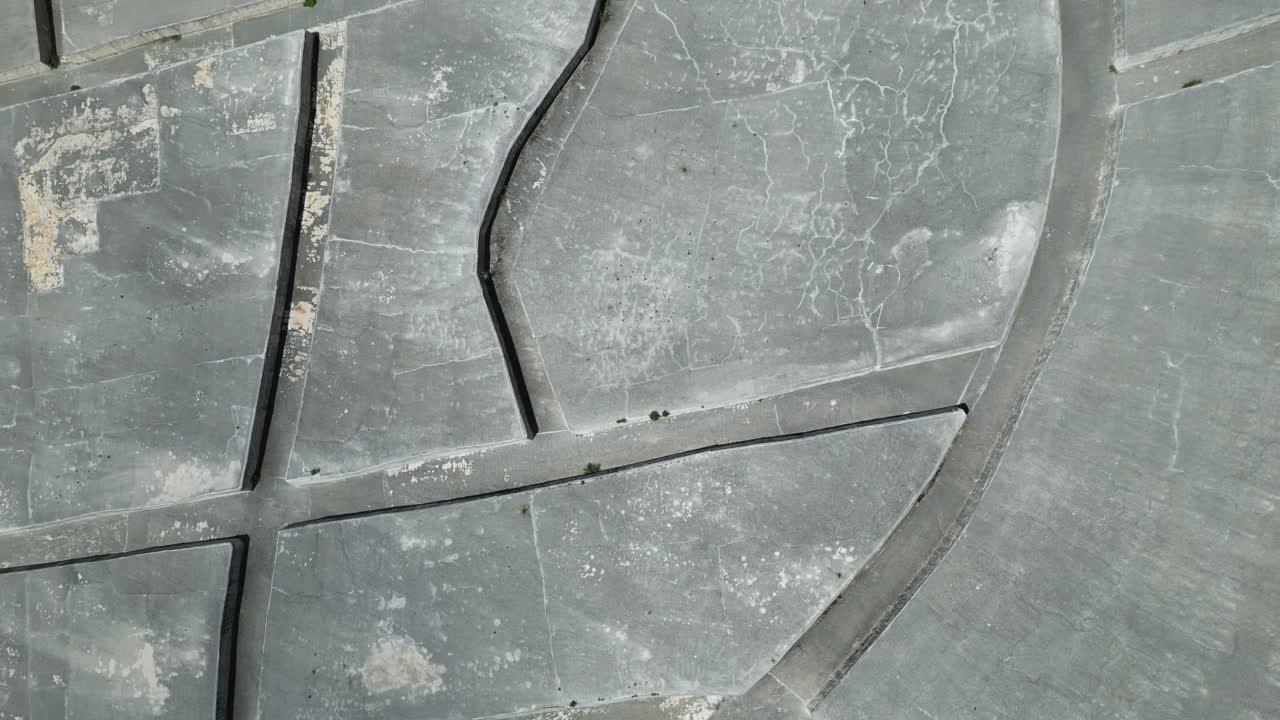 Aerial drone footage of the Cretto di Burri in Sicily: monumental white concrete labyrinth built over old Gibellina’s ruins. Perfect for art, history, and cultural documentary projects