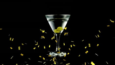 martini glass with olives over black background animation