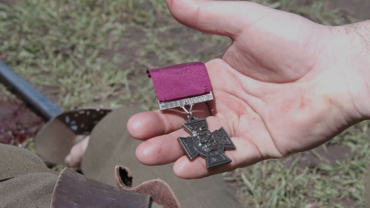A Victorian Cross Medal being picked off a dead solider